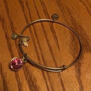 Gold Alex & ani bracelet w/ pink stone